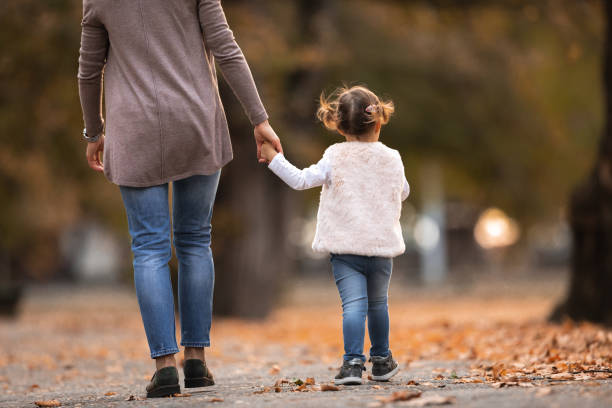 istock Mother and Daughter in the park 1136039405