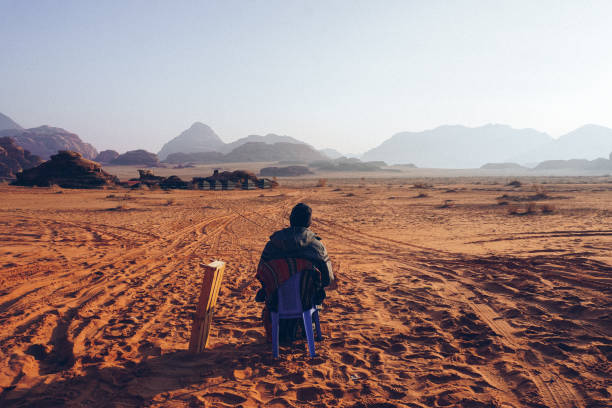istock Man in the desert, travel adventures 1136040159