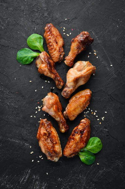 istock Baked chicken wings. Barbecue. Top view. Free space for your text. 1136040442