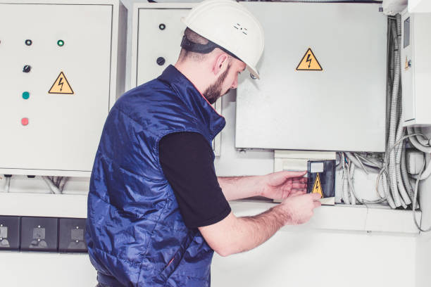 istock The specialist works with powerful electric boxes. A technician turns off electrical machines near a powerful electrical switchboard. Engineer checks the electrical supply system. 1136043202