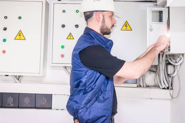 istock The engineer works in the fuse box. A technician checks the control panel of the electrical supply system. Electrician repairs high-voltage machines. 1136043204
