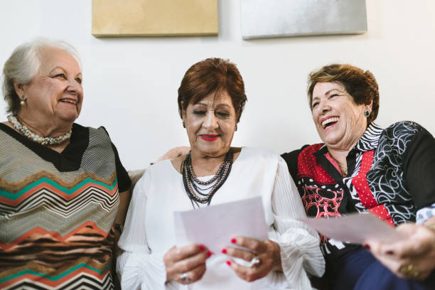 istock Fun at home looking at old family photos 1136043573