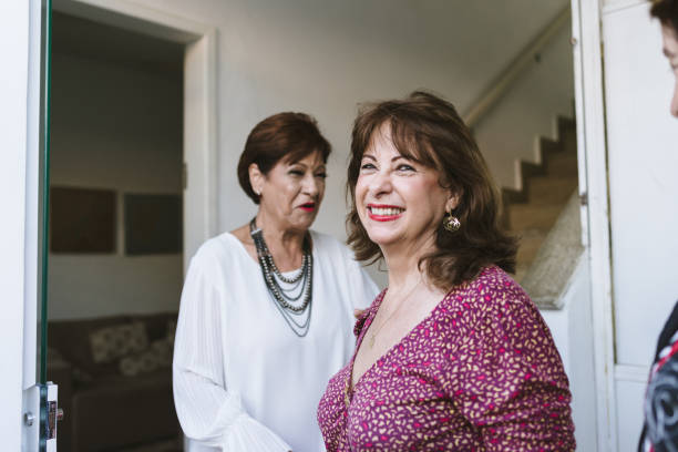istock Receiving senior friends at home 1136043577