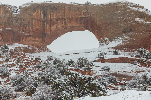 the scenic Wilson's arch south of Moab Utah during a winter snow