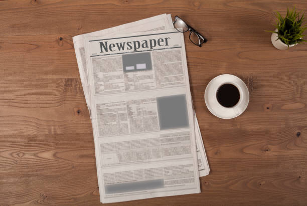 istock newspaper coffee cup and eyeglasses over desk 1136045720