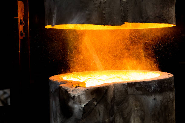 istock metal casting process with red high temperature fire in metal part factory 1136045920