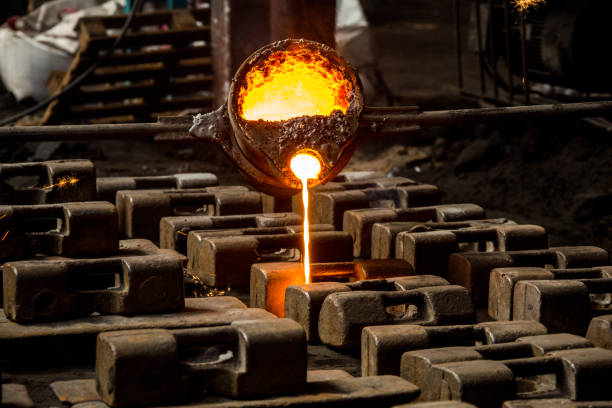 istock metal casting process with red high temperature fire in metal part factory 1136045946