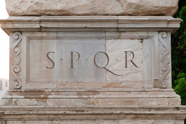 SPQR is an initialism of the ancient Latin phrase meaning: "The Senate and People of Rome". stock photo