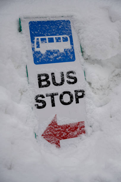 istock Bus stop in snowbus stop sing in snow 1136047317