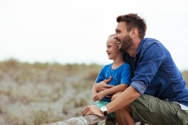 istock Father and son on the beach 1136051353