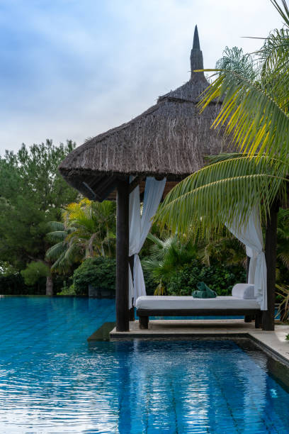 istock Gazebo and lounger on poolside 1136052545