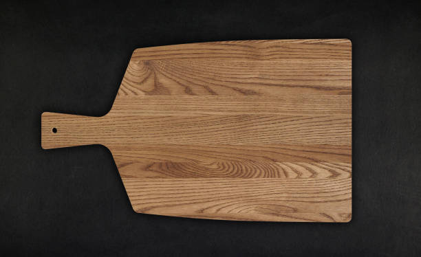 wood cutting board For Food on black background