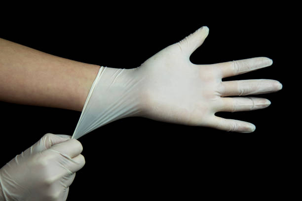 istock hand with white Glove on black 1136055525