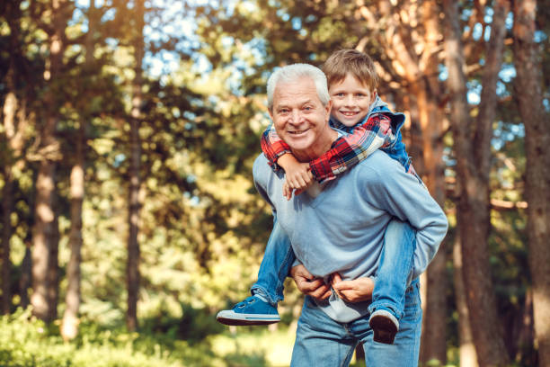istock Grandfather and grandson together outdoors family concept 1136056310