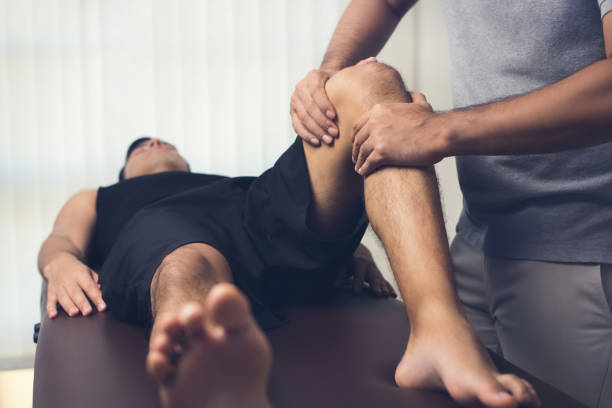 istock Physiotherapist treating athlete male patient 1136060797