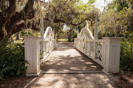 Estero, Florida, USA - February 23, 2019:  Old wooden bridge along the riverway at historic Koreshan State Park.