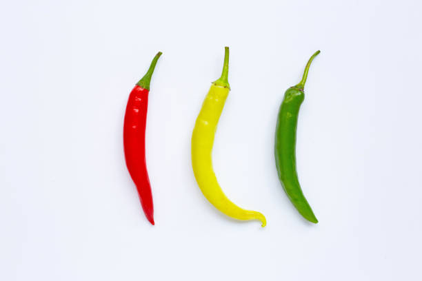 istock Different colors chili peppers isolated on white. 1136063380
