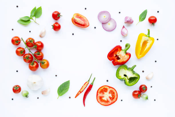 istock Various fresh vegetables and herbs on white background. Healthy eating concept 1136063456