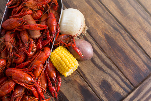 istock Boiled Crawfish on a Wood Background 1136068483