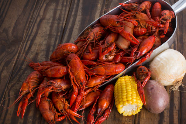 istock Boiled Crawfish on a Wood Background 1136068486