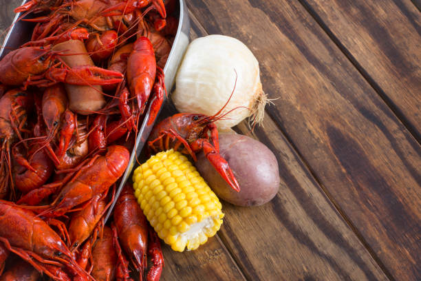 istock Boiled Crawfish on a Wood Background 1136068492