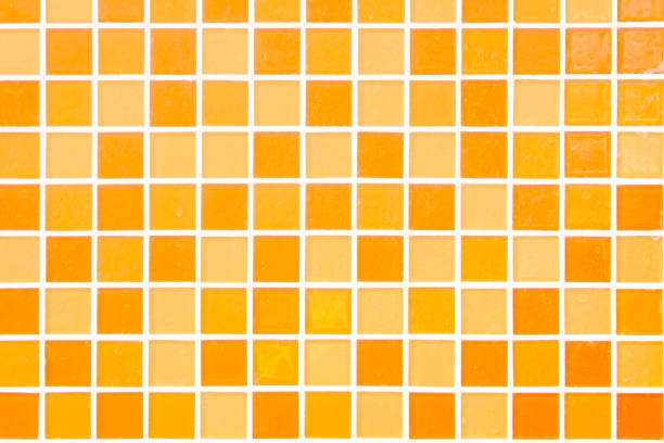 A mosaic of small gold tiles running diagonally across the image.  The location is a Thai Buddhist temple in Bangkok, Thailand.