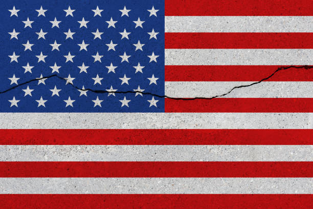 istock United States flag on concrete wall with crack 1136070741