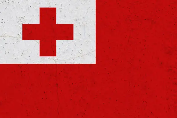 Photo of Tonga flag on concrete wall