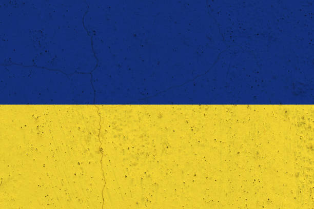 istock Ukraine flag on concrete wall 1136070818