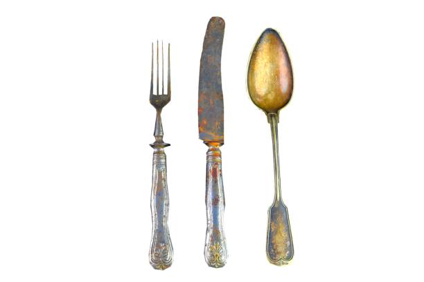 istock Vintage cutlery on a white background. Top view. Crazy concept for culinary and modern life. Contrast between shabby cutlery and excellent modern color 1136072909