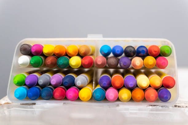 istock colorful crayons in the transparent box.selective focus shot and grain effect 1136078883
