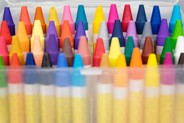 istock colorful crayons in the transparent box.selective focus shot and grain effect 1136078898
