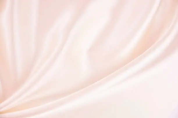 Photo of Texture satin fabric pink color for the background