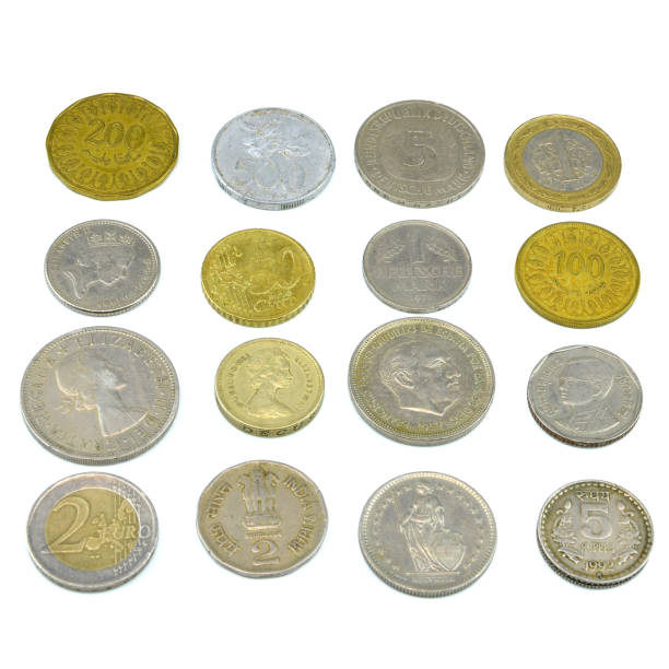 istock Silver and copper coins from around the world on isolated background 1136082605