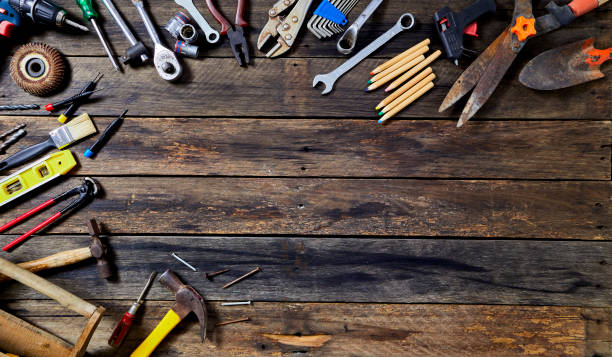 istock 1st MAY Labour Day word many tools on a old wooden background with copy space 1136086381