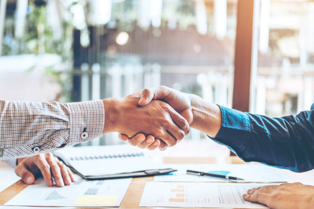 istock Business people colleagues shaking hands meeting Planning Strategy Analysis Concept 1136089245