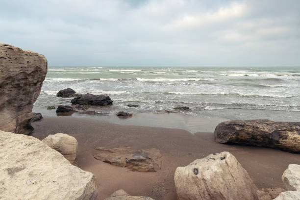 istock Rocky sea coast in cloudy weather 1136090316