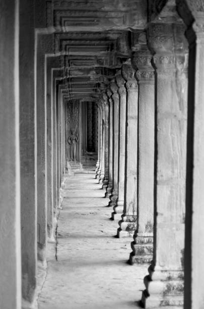 istock A black and white image showing a row of stone pillars. 1136091740