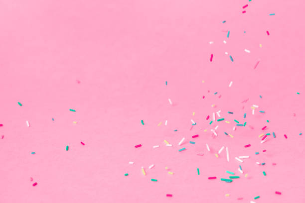 istock falling down trendy futuristic neon colorful sprinkles on pink background 1136092683