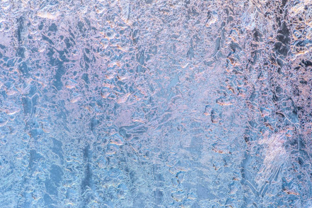istock abstract winter ice texture on window, festive frost patterns background, close up 1136092688