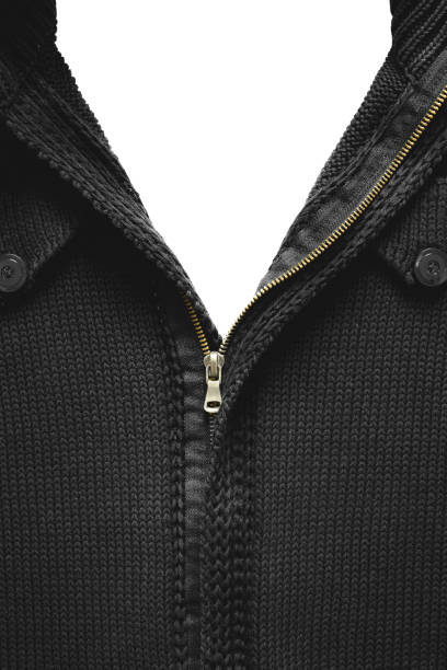 Unbuttoned yellow zipper on a black knitted sweater. Close up