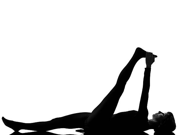 istock woman supta padangusthasana 1  Hand To Big Toe Pose 113609656