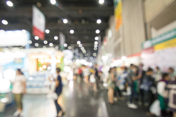 istock Abstract people walking in exhibition blurred background 1136102692