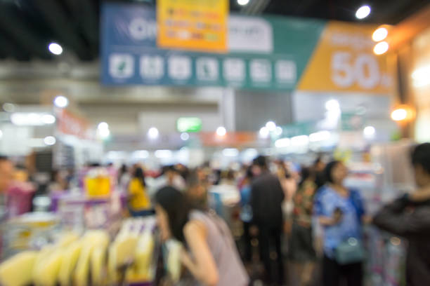 istock Abstract people walking in exhibition blurred background 1136103122
