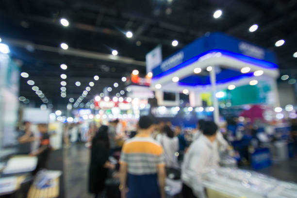 istock Abstract people walking in exhibition blurred background 1136103139