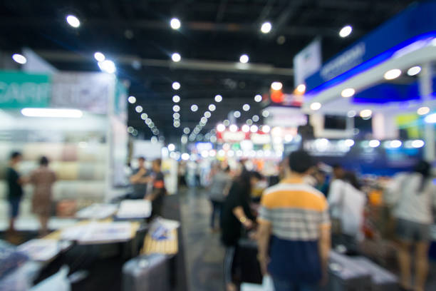 abstract people walking in exhibition blurred background - tradeshow imagens e fotografias de stock