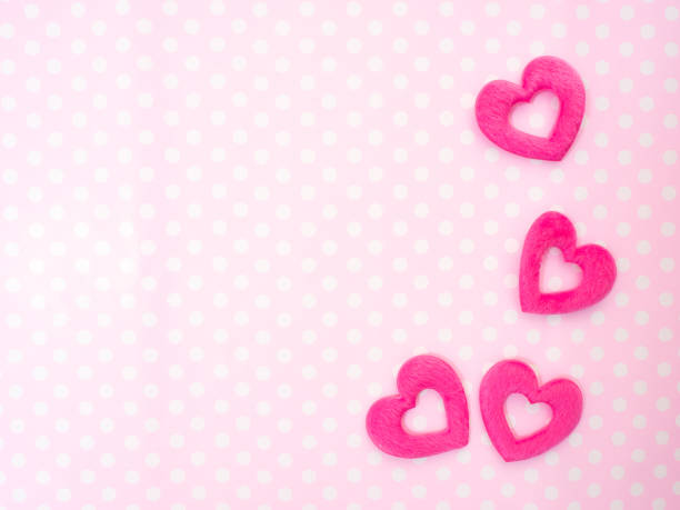 istock paper hearts on pink table top view. 1136107652