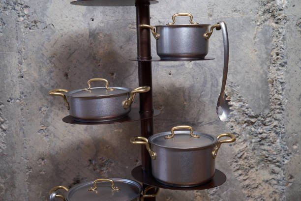 istock Kitchen pan holder stand on concrete wall background with copy space. 1136107909