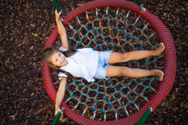 istock happy young girl in nest swing 1136109039