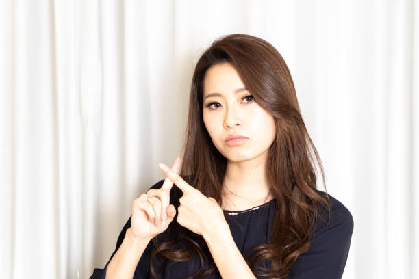 Beautiful young Asian woman say no stock photo